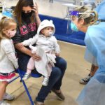 family waits to be tested at rec center
